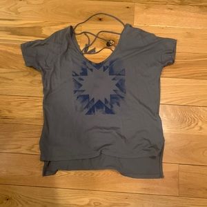 Strapped back off the shoulder tee